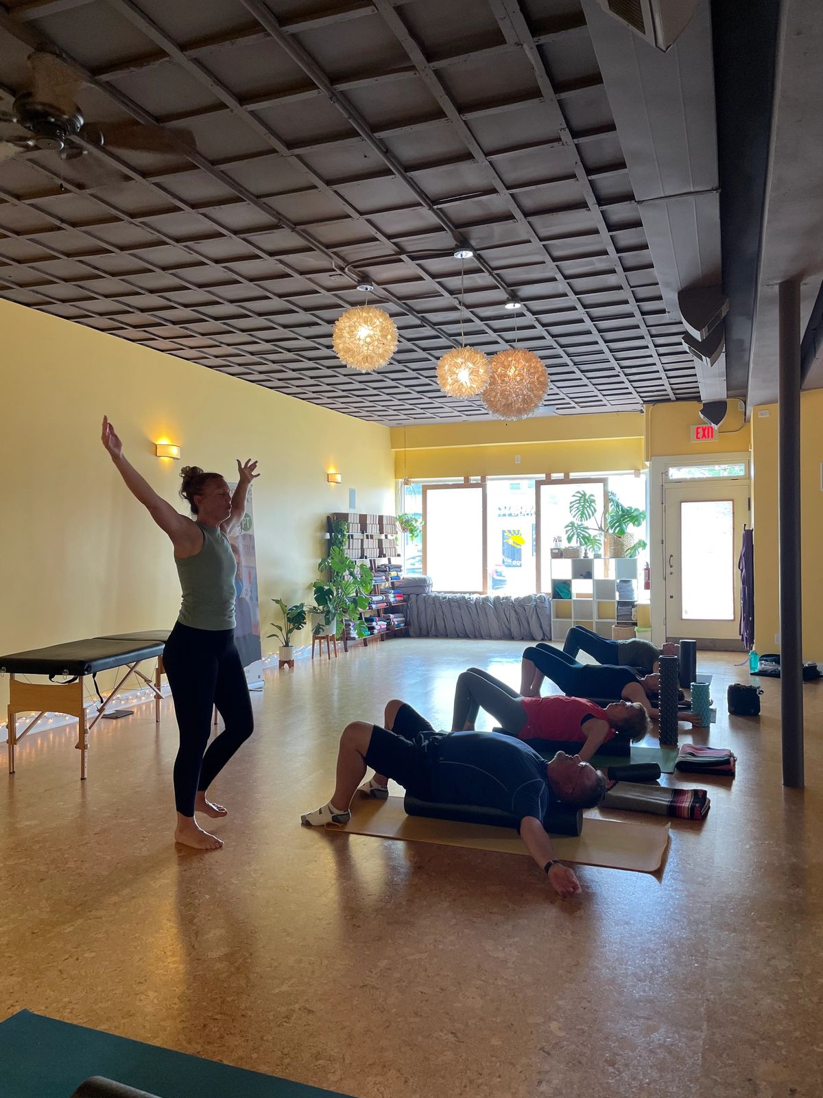 People participating in a guided movement and recovery session at MyPT